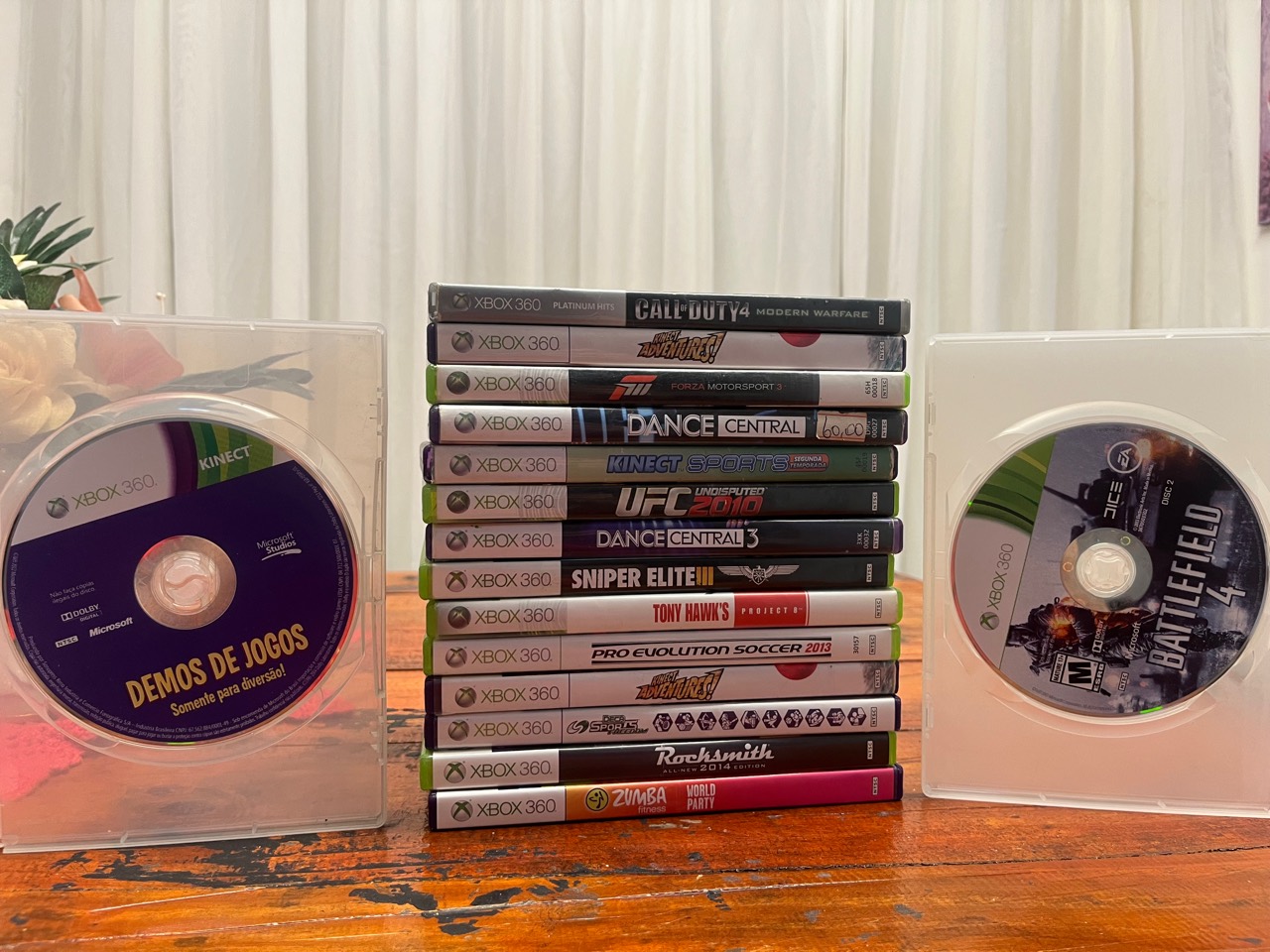 Foto real do lote com 16 jogos originais para Xbox 360